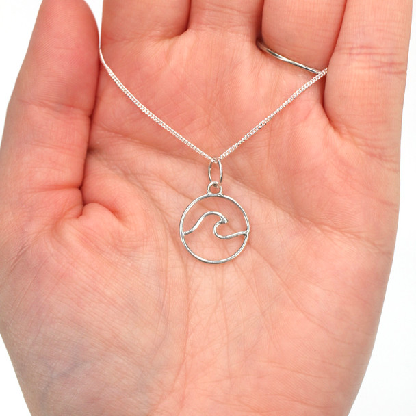 Sterling Silver Wave Charm on model for color reference. 