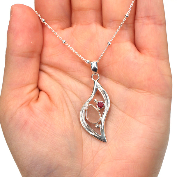 Pink Teardrop Sea Glass and Ruby Wavy Necklace on model for color reference.