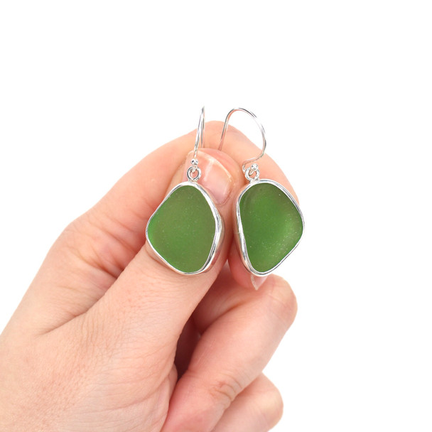 Green Vibrant Sea Glass Single Bezel Earrings on model for color reference.