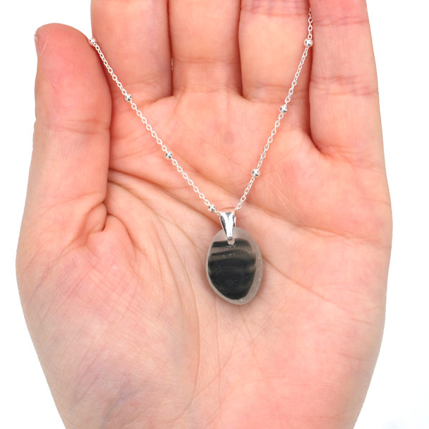 Gray Waves Ultra Rare Sea Glass Drop Necklace on model for color reference. 