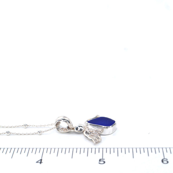 Cobalt Sea Glass Angel Necklace on ruler for size reference.