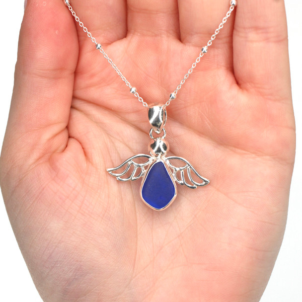 Cobalt Sea Glass Angel Necklace on model for color reference.