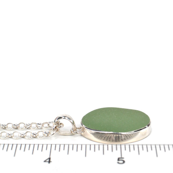 Seafoam Bright Oval Sea Glass Bezel Necklace on ruler for size reference.