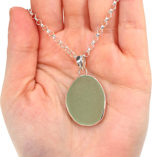 Seafoam Bright Oval Sea Glass Bezel Necklace on model for color reference.