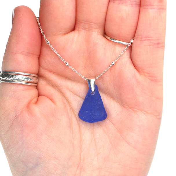 Cobalt Bright Sea Glass Bottle Lip Pinch Necklace on model for color reference. 
