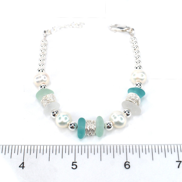 Sky Sea Glass and Pearl Beaded Bracelet on ruler for size reference.