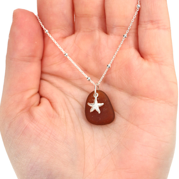 Amber Sea Glass and Tiny Starfish Nautical Charm Necklace on model for color reference.