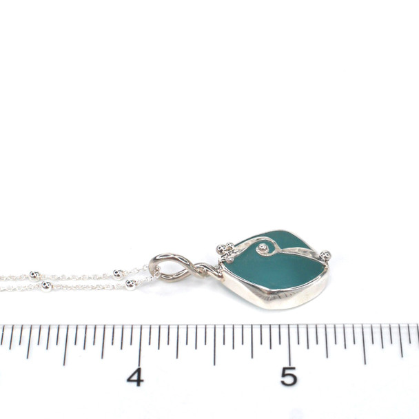 Aqua Sea Glass Wave Necklace on ruler for size reference. 

