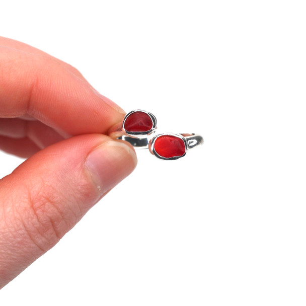 Red Ember Sea Glass Bypass Ring -  Size 9 held to the light