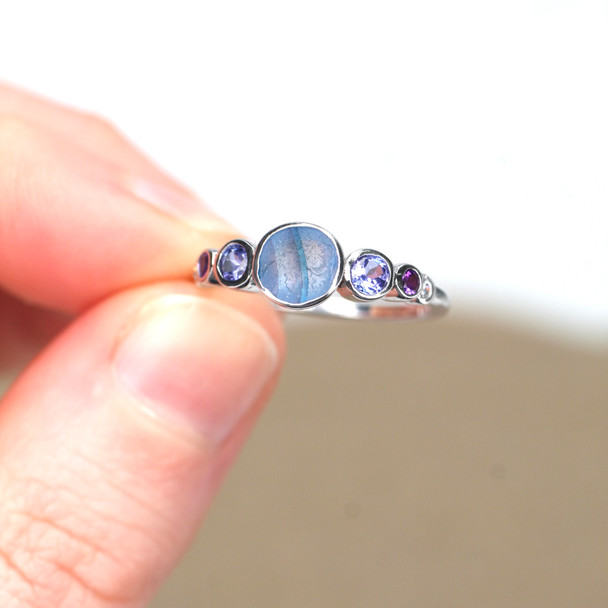 Ocean Winter Breeze Striped Ultra Rare Sea Glass and Gemstone Moon Phases Ring held to the light