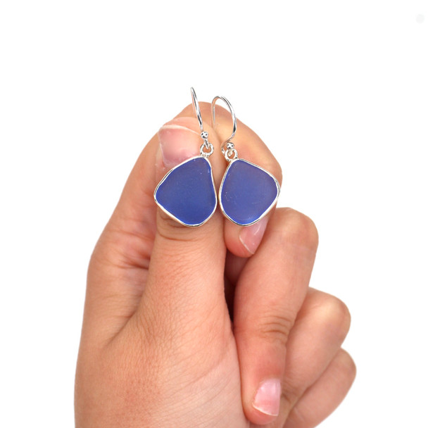 Cornflower Bright Sea Glass Single Bezel Earring on model for color reference. 