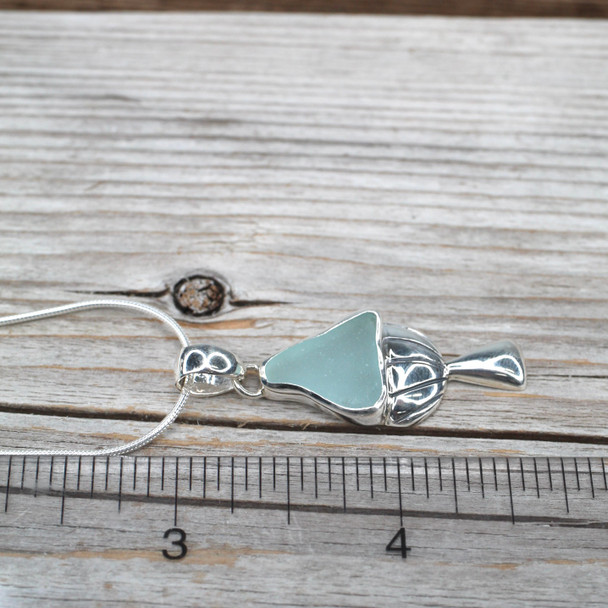 Seafoam Triangle Sea Glass Mushroom Necklace on ruler