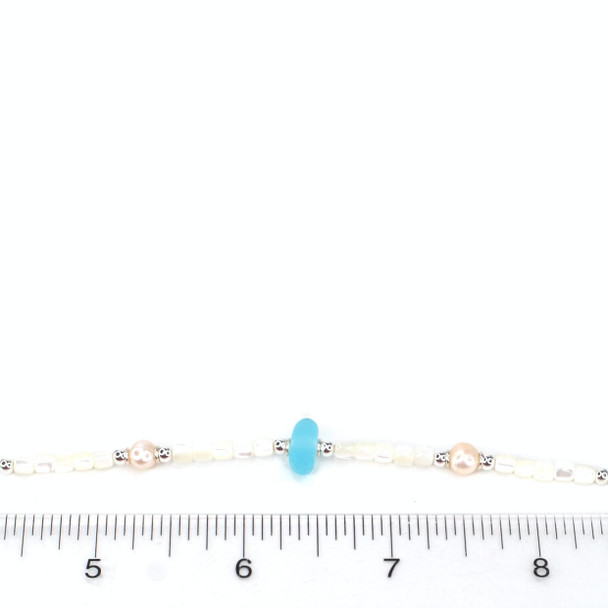 Turquoise Bright Sea Glass Sea Glass Pearl and Mother of Pearl Pearl Necklace on ruler for size reference.  Turquoise Bright Sea Glass Sea Glass Pearl and Mother of Pearl Pearl Necklace on ruler for size reference.