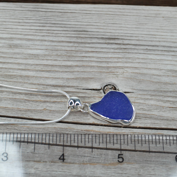 Cobalt Sea Glass Whale Tale Bezel Necklace on ruler for size reference