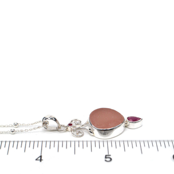 Pink Sea Glass and Ruby Coastal Currents Necklace on ruler for size reference.