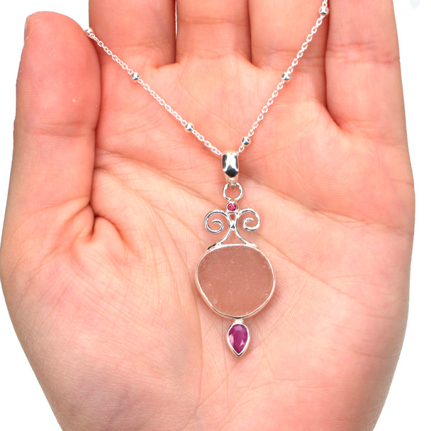 Pink Sea Glass and Ruby Coastal Currents Necklace on model for color reference.