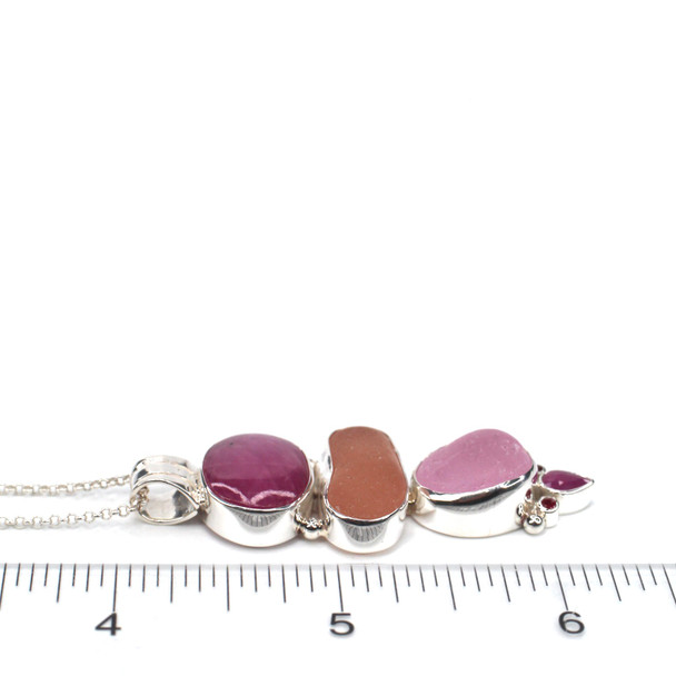 Pink Sea Glass and Ruby Etched Bail Necklace on ruler for size reference.