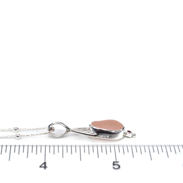 Pink Sea Glass and Ruby Lunar Drop Necklace on ruler for size reference.