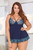 Scallop lace and microfiber babydoll with strappy soft cups, under bust tricot lining, scallop lace trimmed microfiber skirt and G-string.