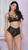 Mesh underwire soft cup bra with strappy back detail and hook and eye closure.
