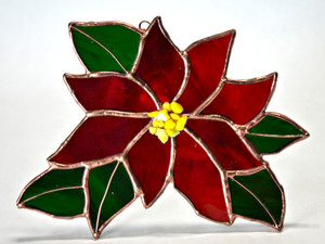 Christmas Poinsettia art glass suncatcher in red, green, and yellow Christmas Poinsettia art glass suncatcher in red, green, and yellow