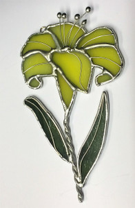 Yellow lily flower with green leaves art glass suncatcher Yellow lily flower with green leaves art glass suncatcher