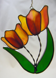 Orange double tulip art glass suncatcher with green leaves Orange double tulip art glass suncatcher with green leaves