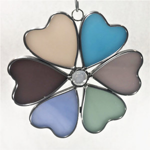 Circle of Hearts art glass suncatcher in shades of pink, purple, blue, and green