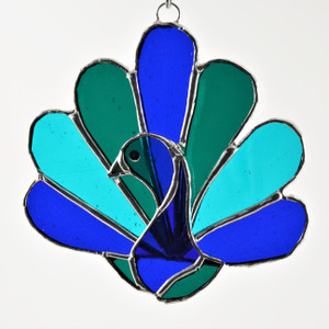 Peacock art glass suncatcher in blues and greens