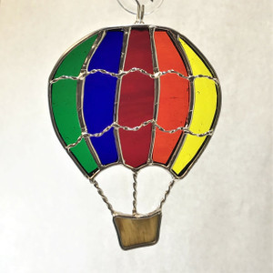 Rainbow Hot Air Balloon art glass suncatcher in green, blue, red, orange, yellow, and brown Rainbow Hot Air Balloon art glass suncatcher in green, blue, red, orange, yellow, and brown
