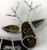 Close up of brown standing reindeer art glass Christmas suncatcher with black nose
