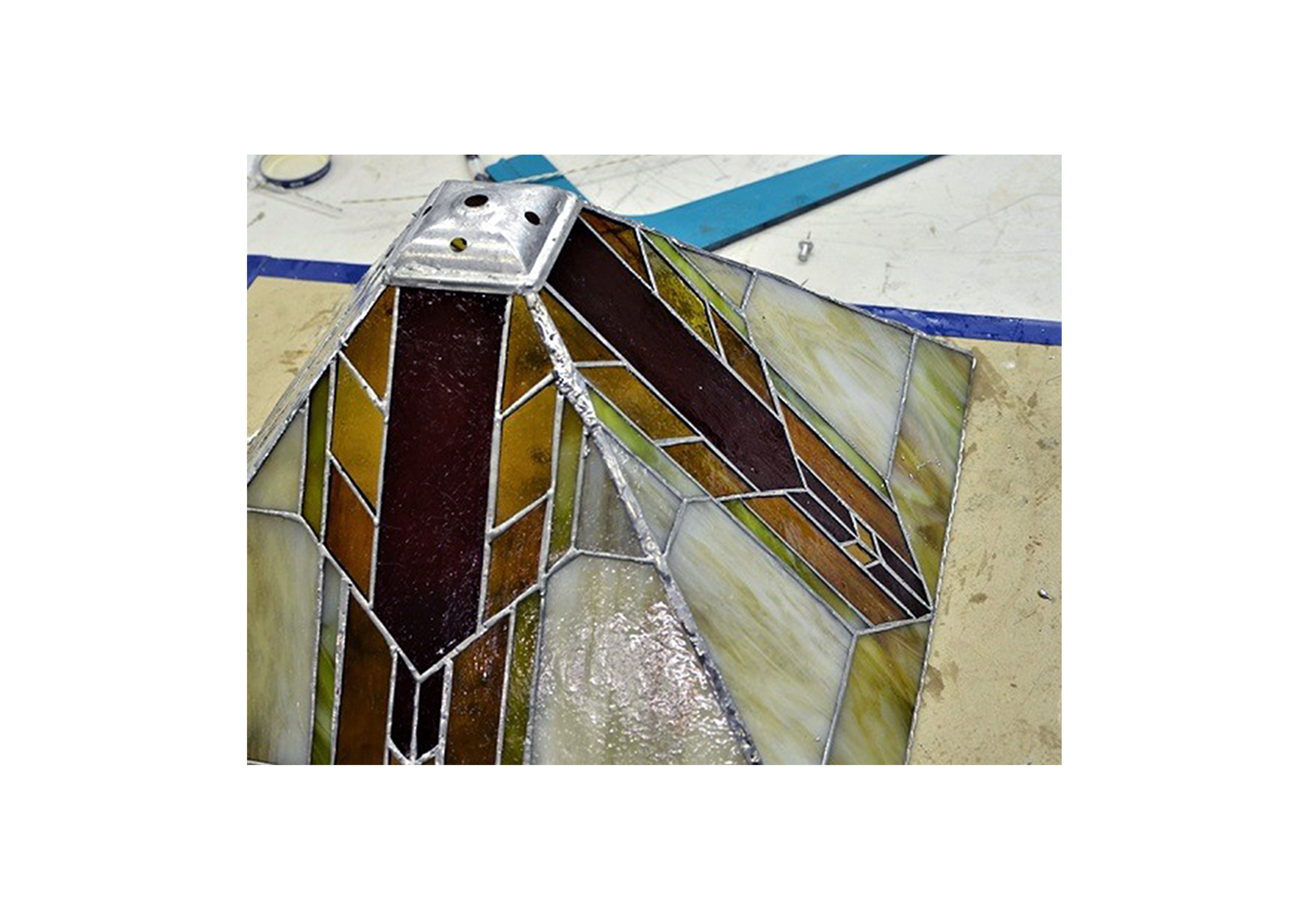 an in-progress stained glass lampshade