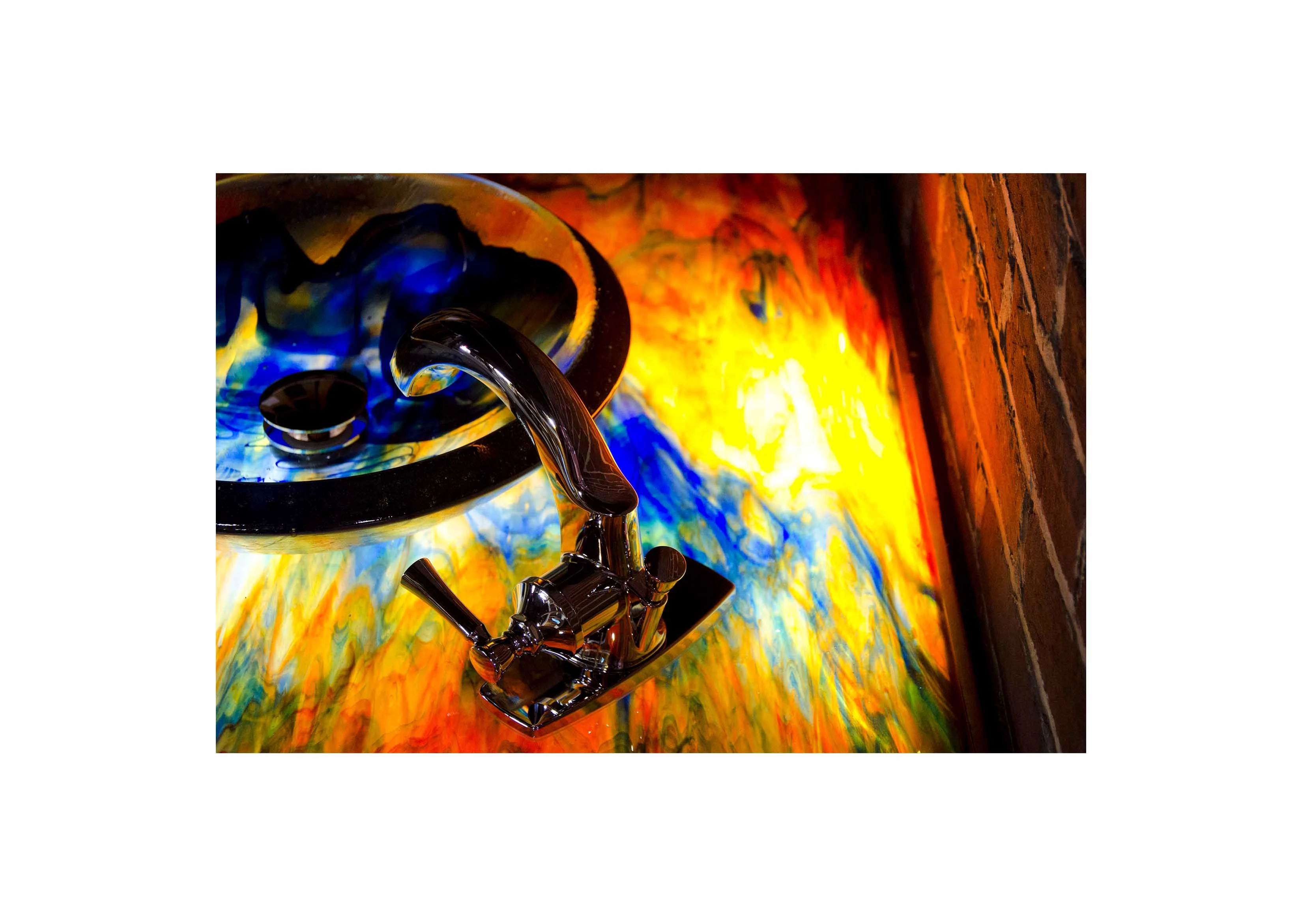 a multi-colored glass countertop with backlighting