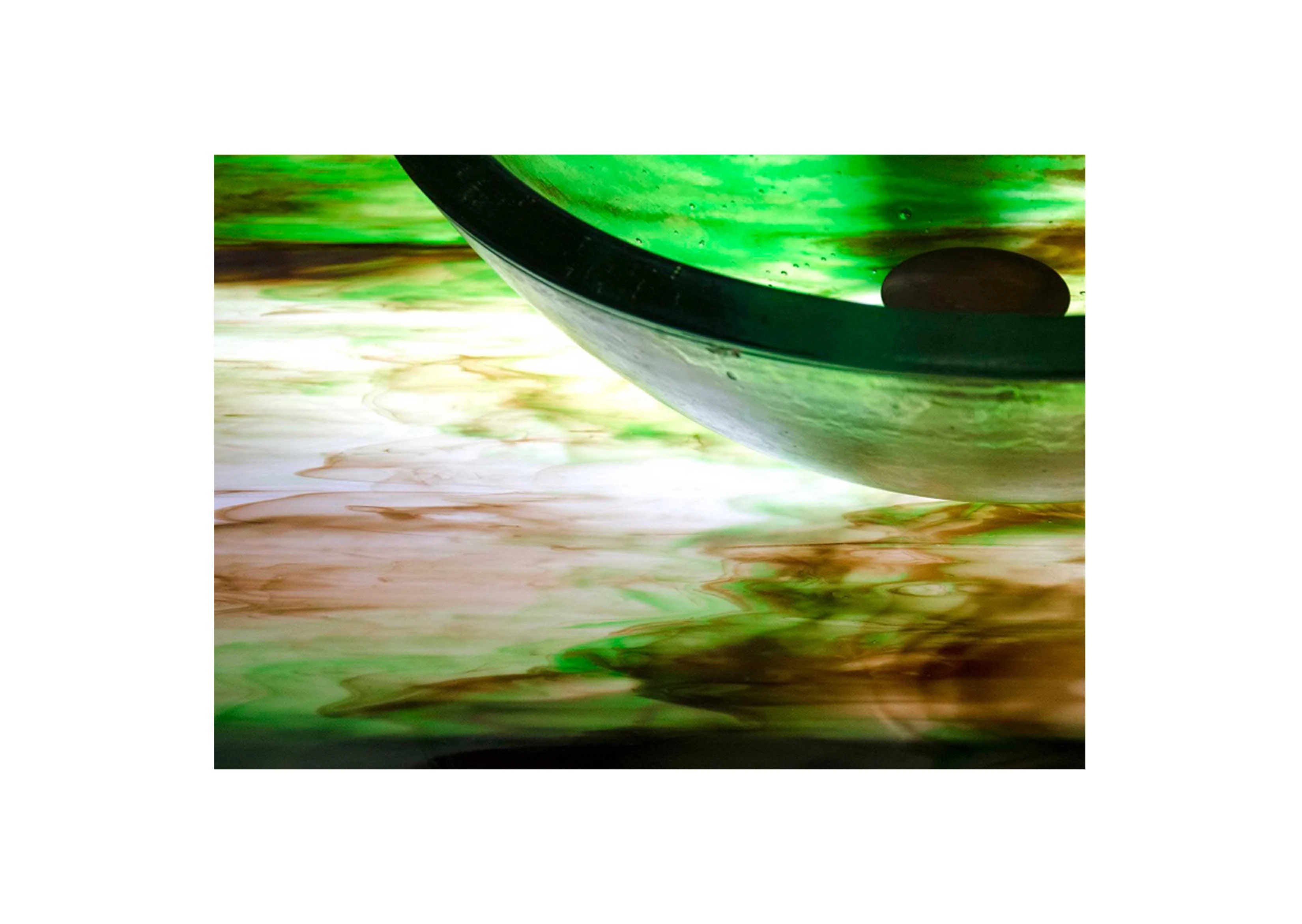 a multi-colored glass countertop with backlighting