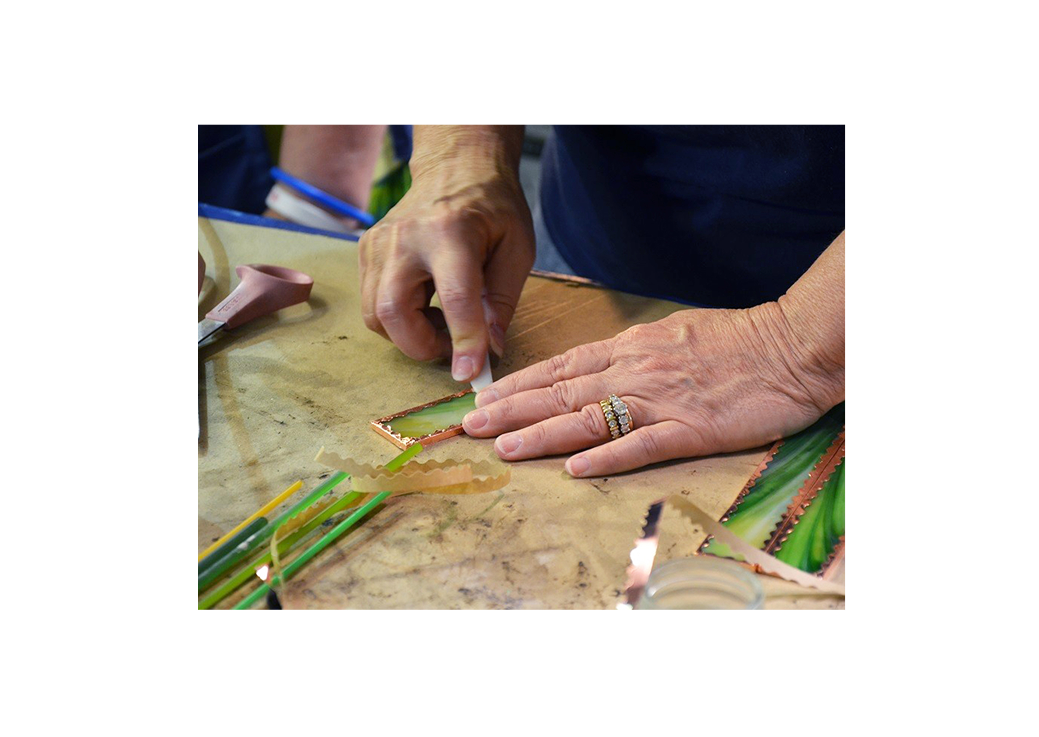 a student working on a stained glass project