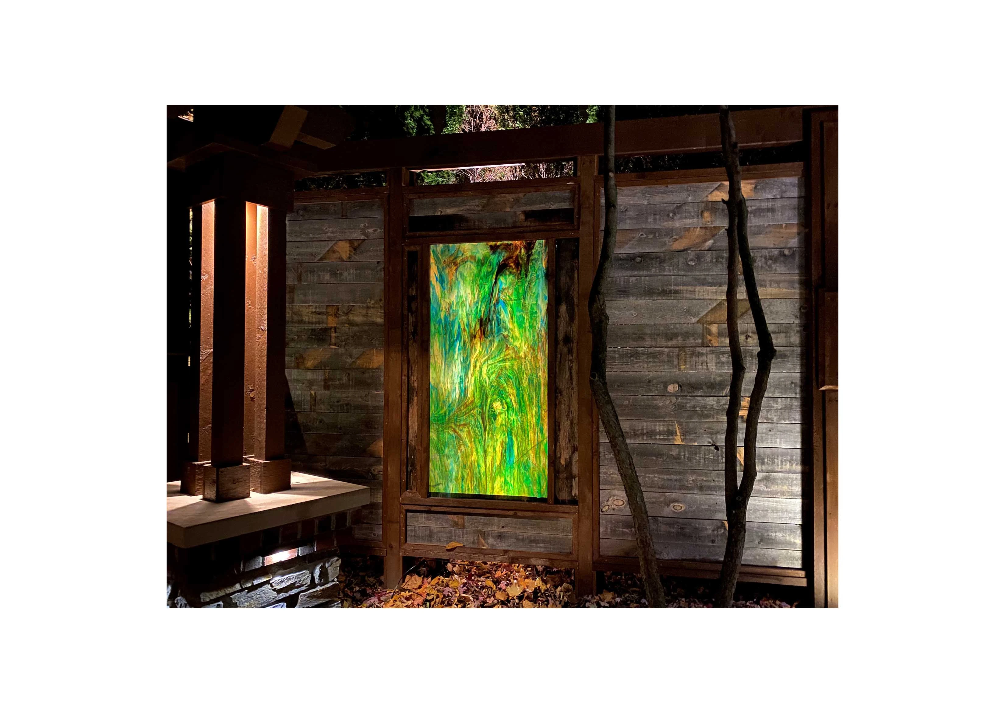 a mixed green exterior glass panel in a garden