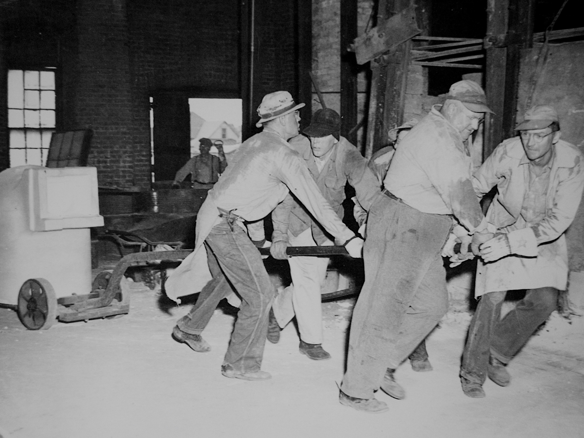 vintage photograph of men working in the factory