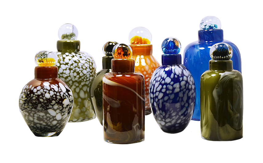 small blown glass pet urns of varying sizes and colors
