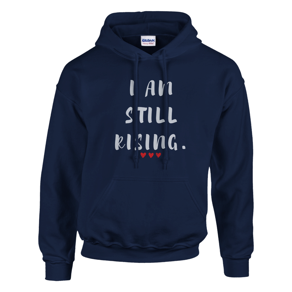 Front view of a navy blue hoodie featuring the inspirational “I AM STILL RISING” design with three red hearts. Motivational unisex sweatshirt promoting resilience, strength, perseverance, self-confidence, and personal growth.