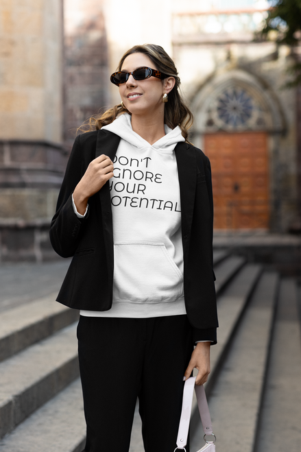 modest  fashion  inspired  mockup  of  a  woman  wearing  a  white pullover  hoodie  under  a  blazer with DON'T IGNORE YOUR POTENTIAL