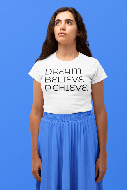 White  t-shirt  mockup  featuring  a  woman  looking  up with DREAM. BELIEVE. ACHIEVE.