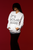 spotlight  styled  mockup  of  a  woman  posing  with  a  white gildan  hoodie with IT’S YOUR YEAR
