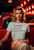 Sport grey t-shirt  mockup  featuring  a  woman  in  a  50s  inspired  outfit  posing  by  a  classic  car with CHASE YOUR DREAMS