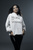 white gildan  hoodie  mockup  featuring  a  woman  with  long  hair  and  graphic  makeup with BELIEVE IN YOURSELF