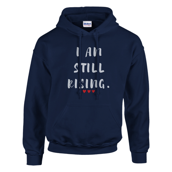 Front view of a navy blue hoodie featuring the inspirational “I AM STILL RISING” design with three red hearts. Motivational unisex sweatshirt promoting resilience, strength, perseverance, self-confidence, and personal growth.