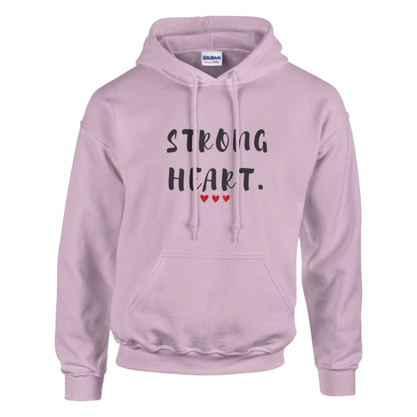 Light pink pullover hoodie displayed against a light gray background. The front features the empowering message “STRONG HEART.” in distressed black lettering, accented by three small red hearts beneath the text. The hoodie includes a drawstring hood, kangaroo pocket, and ribbed cuffs and hem. The soft pink color adds a warm and uplifting touch to the design, while the message symbolizes courage, resilience, hope, and inner strength. Ideal for cancer awareness, recovery journeys, heart health advocacy, and everyday inspiration.