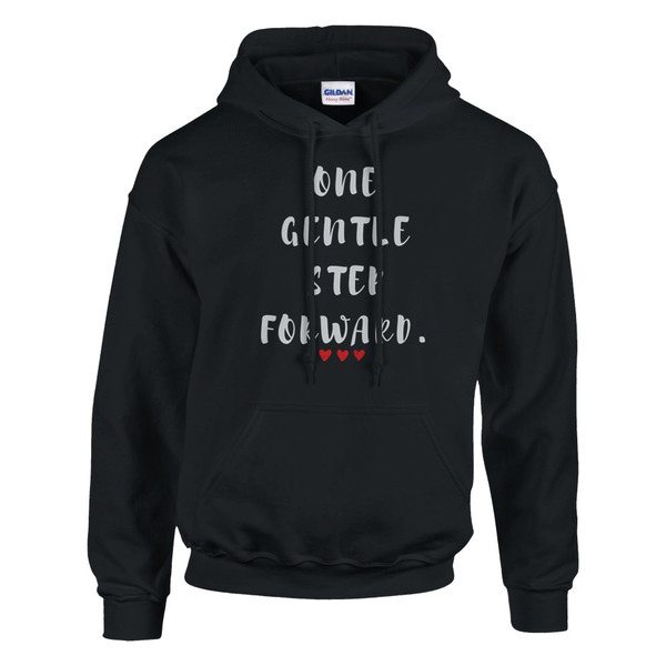 Black pullover hoodie featuring the inspirational quote “One Gentle Step Forward” in distressed white lettering with red heart accents, displayed on a plain background.