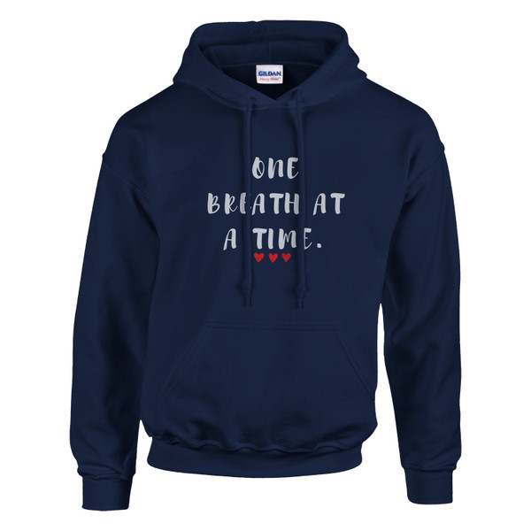 NAVY pullover hoodie featuring the inspirational quote “One Breath at a Time” with red heart accents, motivational unisex sweatshirt design promoting mindfulness, resilience, self-care, emotional wellness, and inner strength.