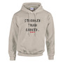 Person wearing a sand-colored pullover hoodie with the motivational message “STRONGER THAN CANCER.” printed in distressed black lettering across the chest, accented by three small red hearts beneath the text. The individual is standing in an industrial workshop environment and is wearing a yellow hard hat and safety glasses. Machinery and work equipment are visible in the softly blurred background. The image highlights strength, determination, resilience, and support for those affected by cancer while showcasing the hoodie design in a hardworking, professional setting.