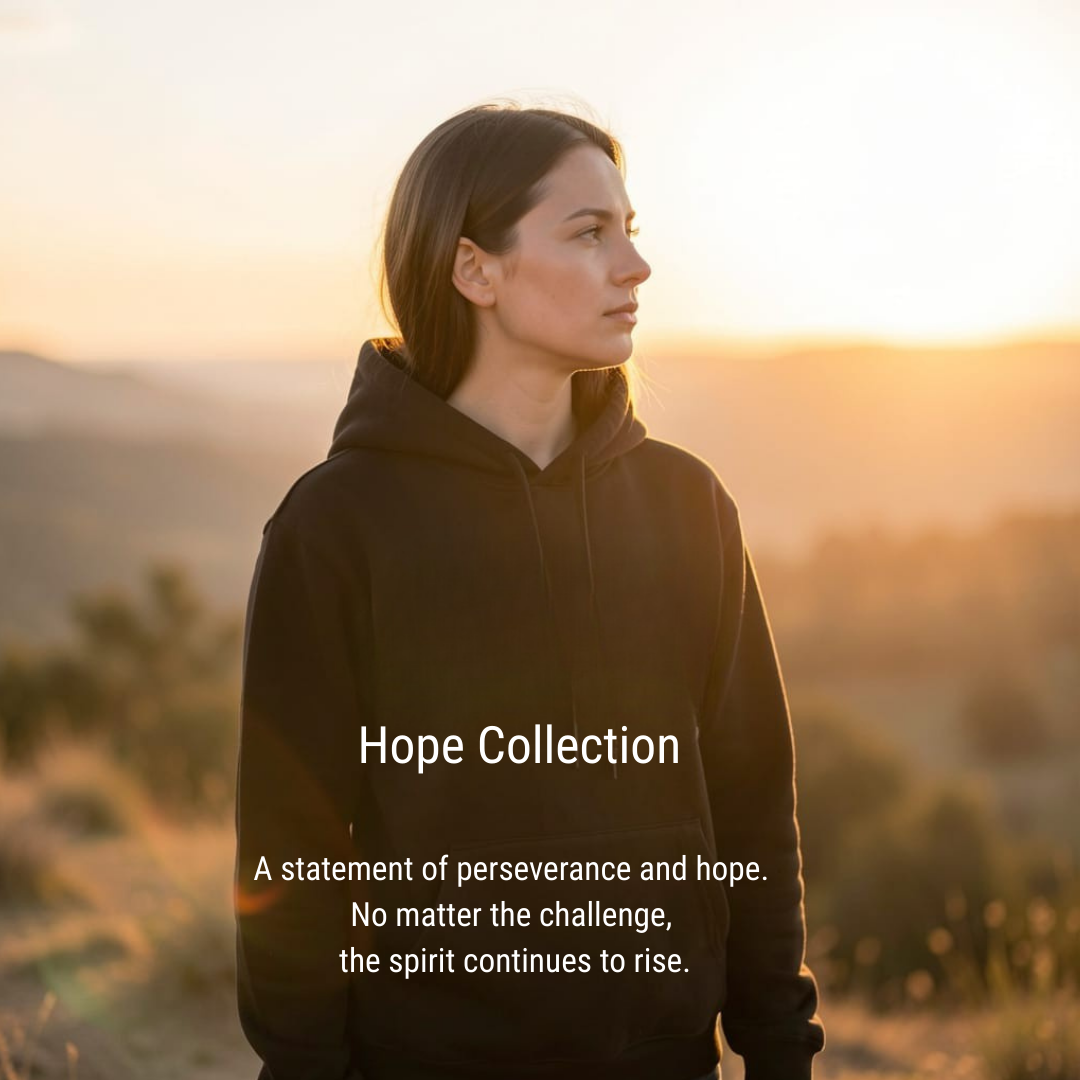 A young Caucasian woman, appearing to be in her early twenties, is positioned in the center of the frame, looking to her right in profile. She has long, dark brown hair, styled naturally, and her facial features are delicate with a neutral, contemplative expression. Her build is average, and she wears a dark, hooded sweatshirt, which obscures most of her body. The background depicts a serene, natural landscape of rolling hills bathed in the warm, golden light of a setting sun. The lighting creates a soft glow and highlights the edges of her hair and shoulders. The atmosphere is tranquil and hopeful, with a shallow depth of field blurring the background to keep the focus on the subject. The perspective is a medium shot, capturing her from the chest up.